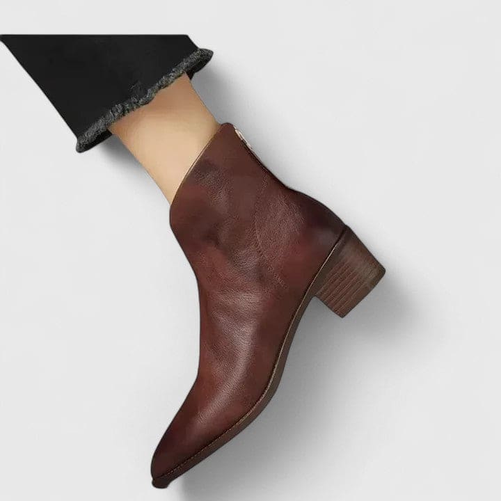 Black ankle boots with block heel and side zipper worn with frayed hem denim shorts_1