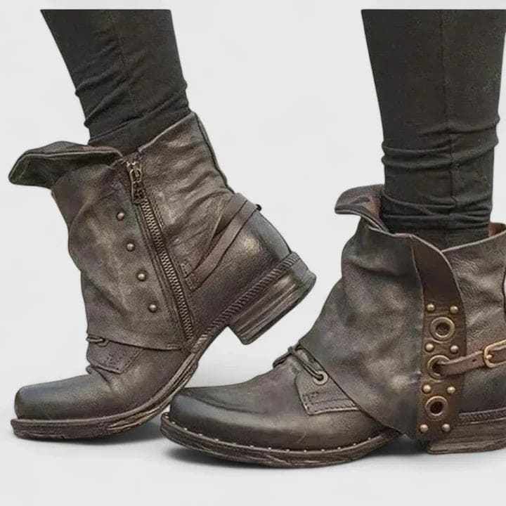 Distressed ankle boots with buckle straps and side zipper worn with dark skinny jeans._1
