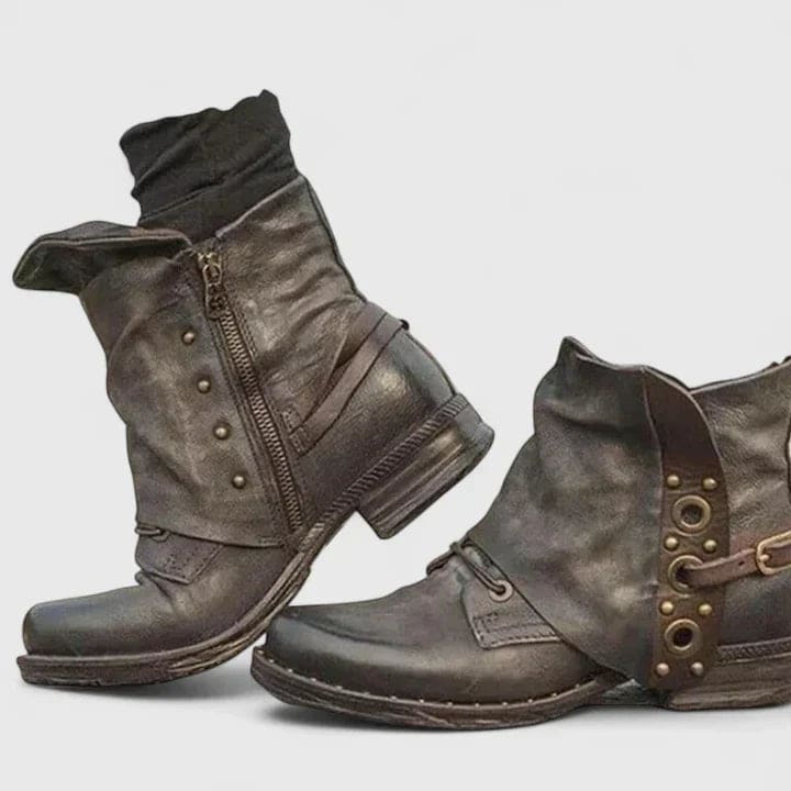Distressed ankle boots with buckle straps and side zipper worn with dark skinny jeans._3
