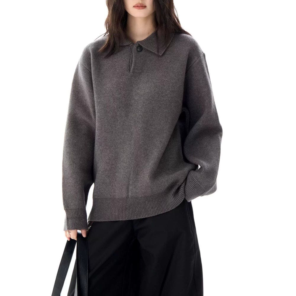 A model wears a relaxed long sleeve pullover sweater with a collared half zip neckline and ribbed trim._2