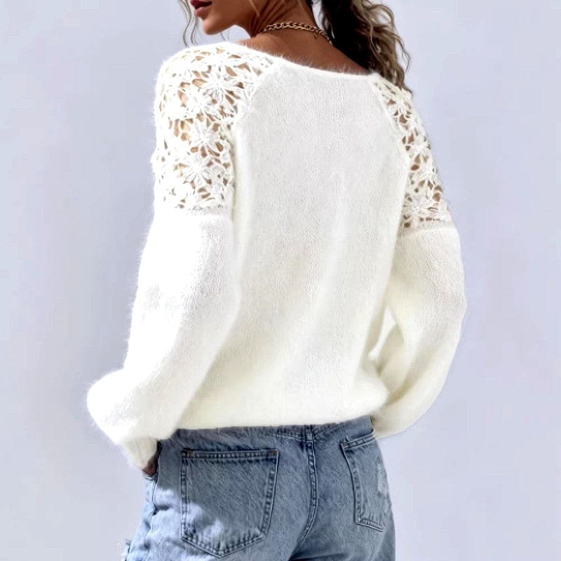 White knit sweater with floral lace panels on the shoulders, a wide neckline and long balloon sleeves, worn with light blue jeans._5