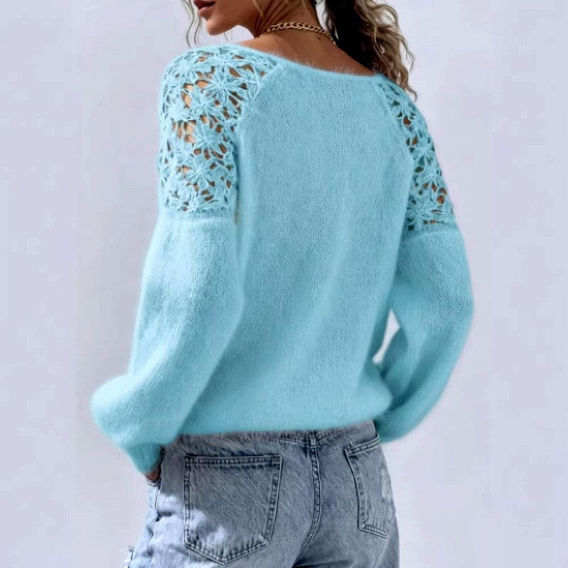 White knit sweater with floral lace panels on the shoulders, a wide neckline and long balloon sleeves, worn with light blue jeans._6