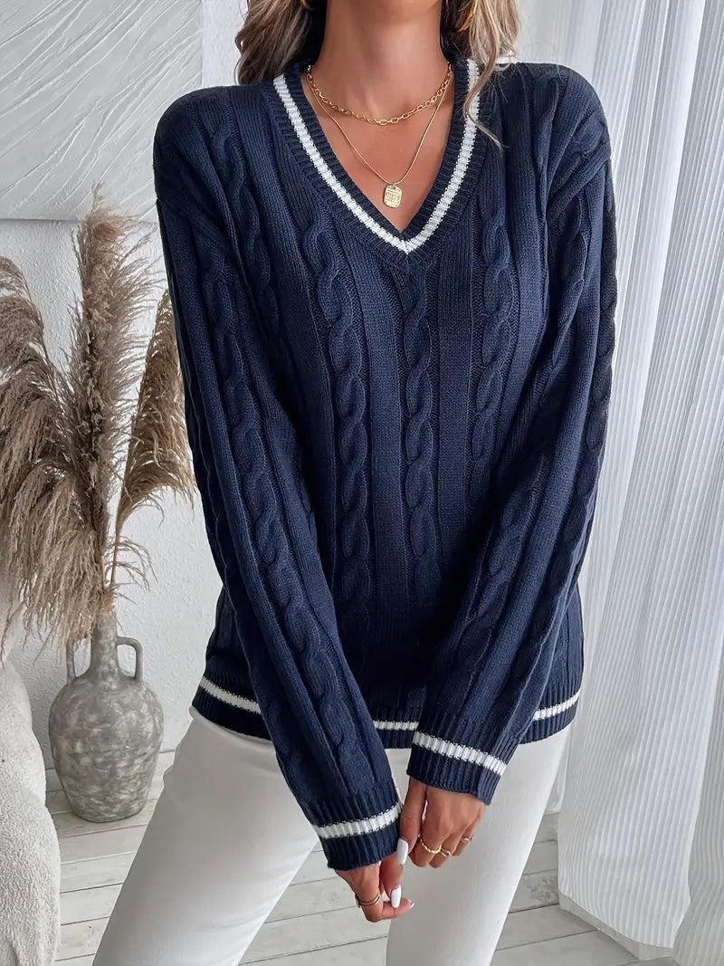 Navy cable-knit V-neck sweater shown straight on, highlighting the striped neckline, ribbed hem, and striped cuffs.