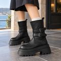 Black mid-calf boots with two buckled ankle straps and a thick lug platform sole, worn with white socks._0