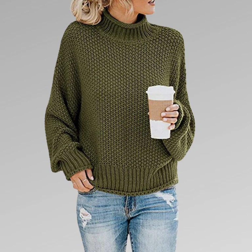 Olive green chunky knit turtleneck sweater with a relaxed fit, textured knit, and ribbed neckline, cuffs, and hem.