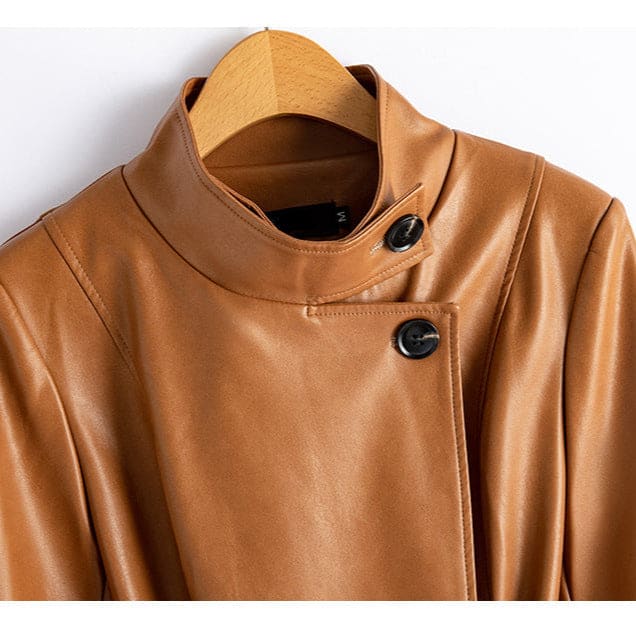 A long burgundy wrap coat with an asymmetric buttoned neckline, waist tie belt, and side welt pockets displayed on a hanger._6