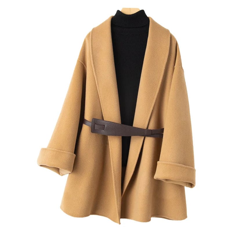A wrap coat with wide sleeves, a kimono inspired silhouette, and an adjustable belt displayed over a black turtleneck._1