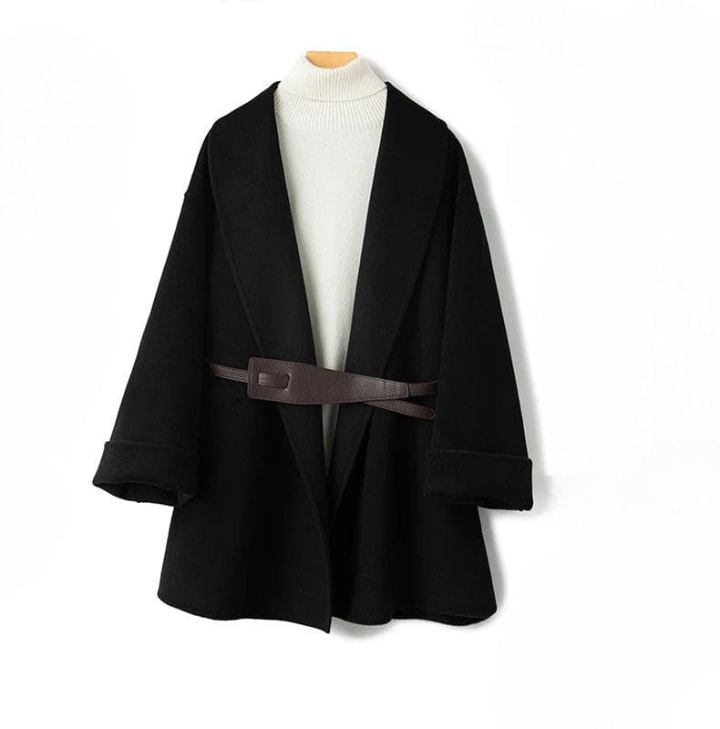 A wrap coat with wide sleeves, a kimono inspired silhouette, and an adjustable belt displayed over a black turtleneck._4