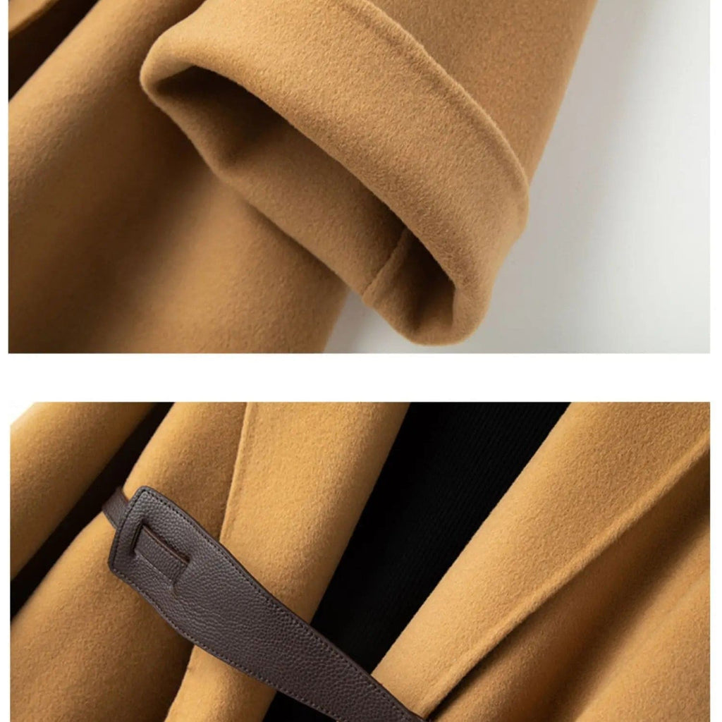 A wrap coat with wide sleeves, a kimono inspired silhouette, and an adjustable belt displayed over a black turtleneck._8