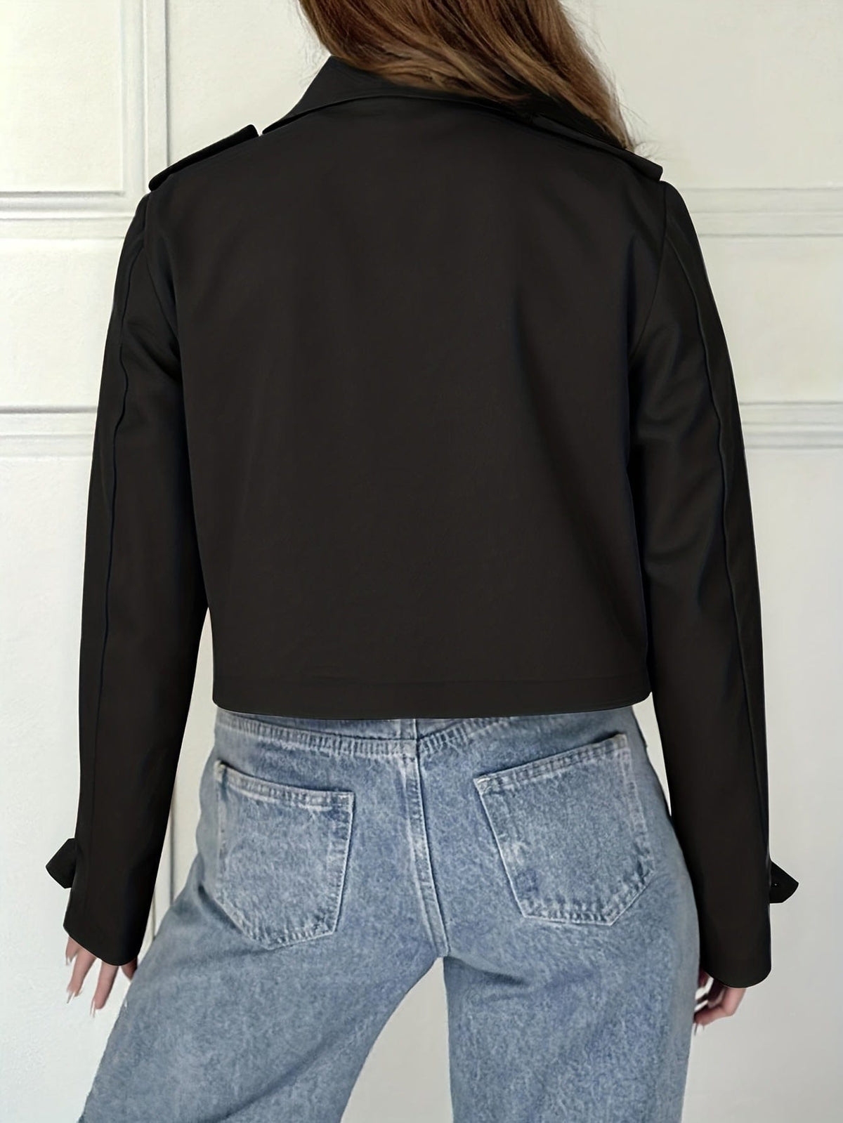 Woman wearing a cropped double breasted pea coat with notched lapel over a white top and light blue jeans._3