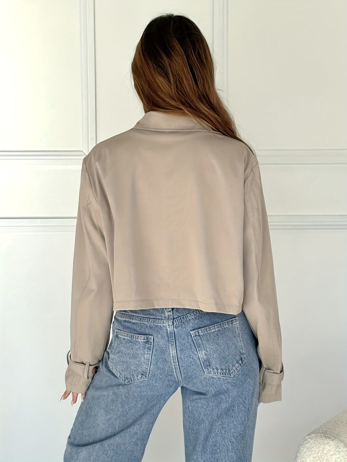 Woman wearing a cropped double breasted pea coat with notch lapel over a white tee and high waisted jeans._1