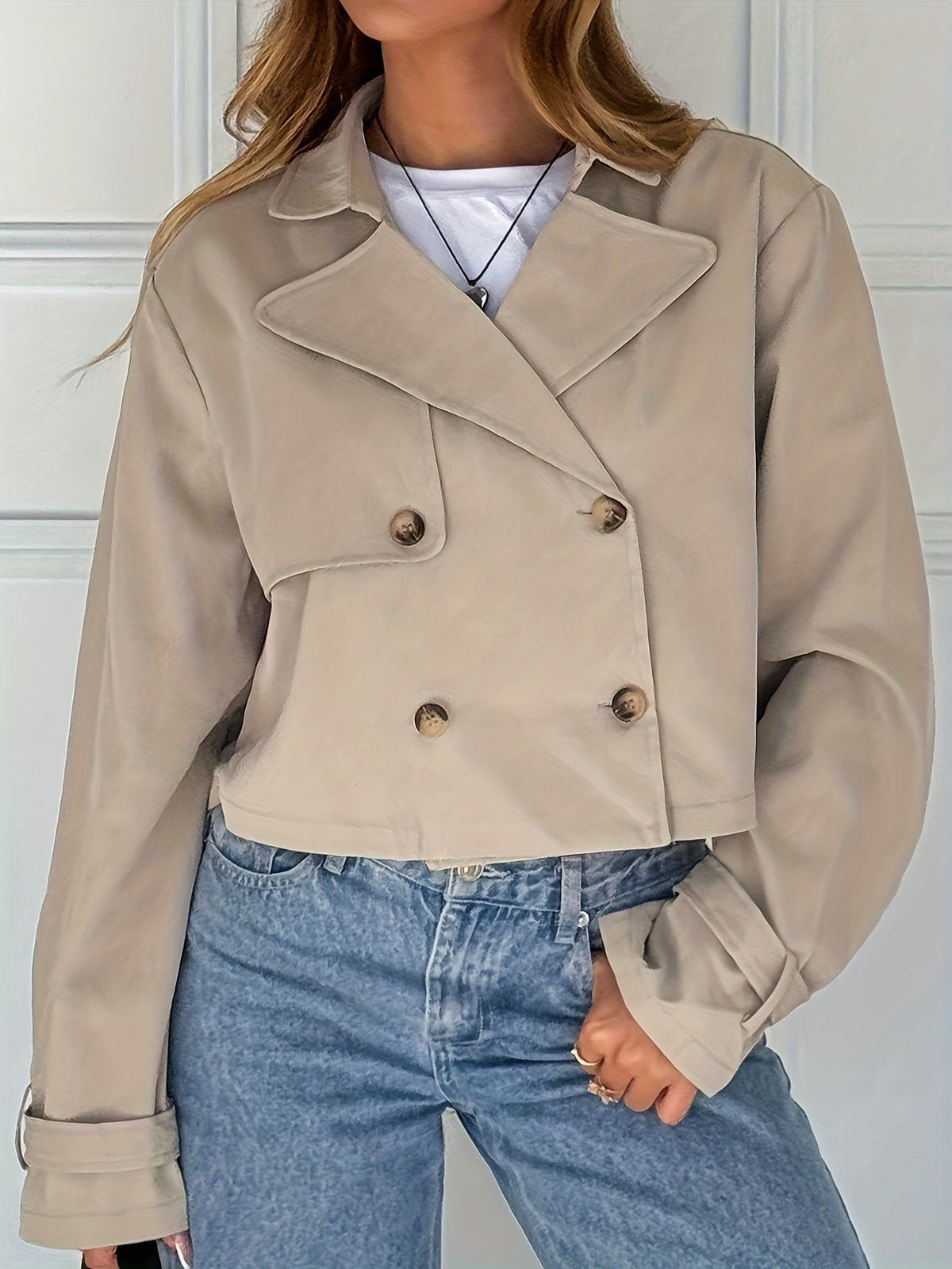 Woman wearing a cropped double breasted pea coat with notch lapel over a white tee and high waisted jeans._2