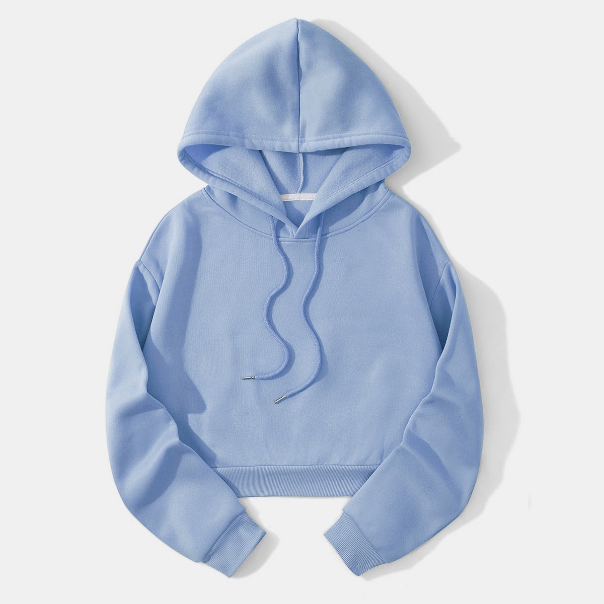 Light blue cropped pullover hoodie shown flat with an open raised hood, roomy sleeves, ribbed cuffs, and front drawstrings.
