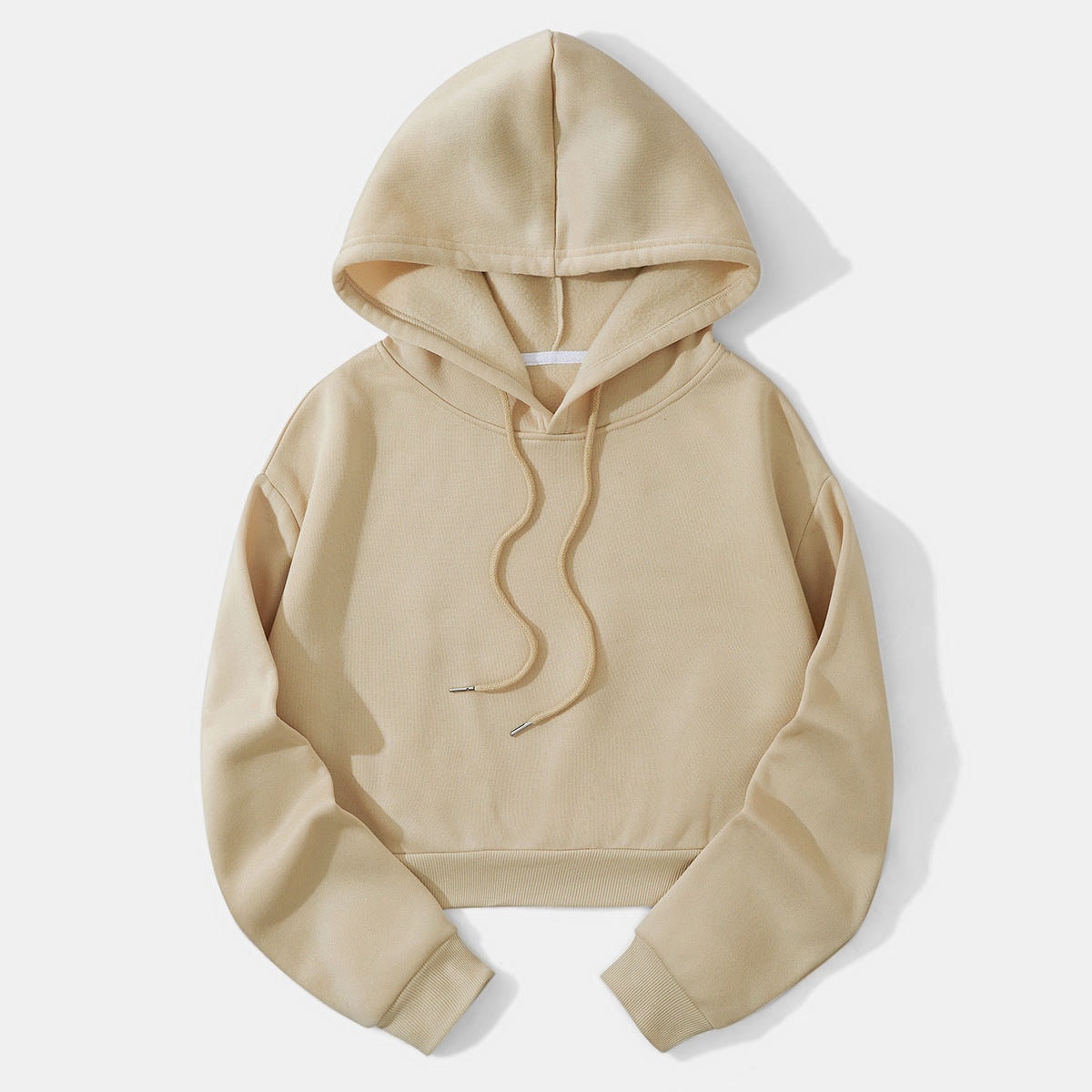 Beige cropped drawstring hoodie displayed flat with a raised hood, long sleeves, ribbed cuffs, and a ribbed hem.