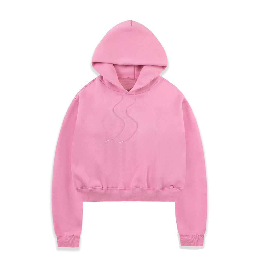 Pink cropped pullover hoodie with the hood raised, long sleeves, ribbed cuffs and hem, and drawstrings extending from the neckline.