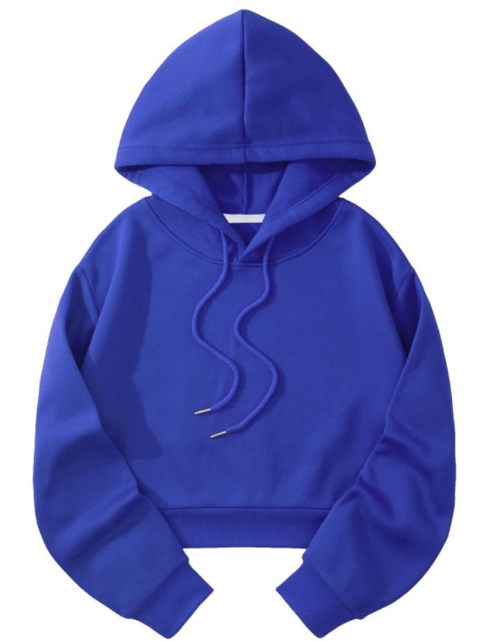 Royal blue cropped hoodie shown flat with the hood raised, curved drawstrings at the front, long sleeves, and a ribbed waistband.