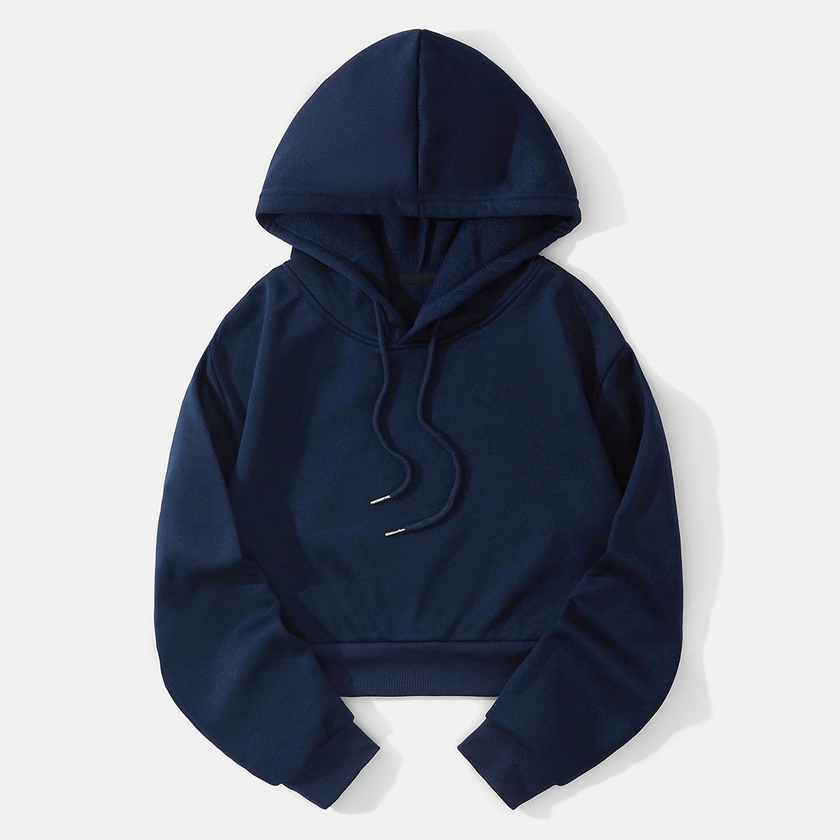 Dark navy cropped drawstring hoodie displayed flat, highlighting the raised hood, roomy sleeves, ribbed hem, and cuffed wrists.