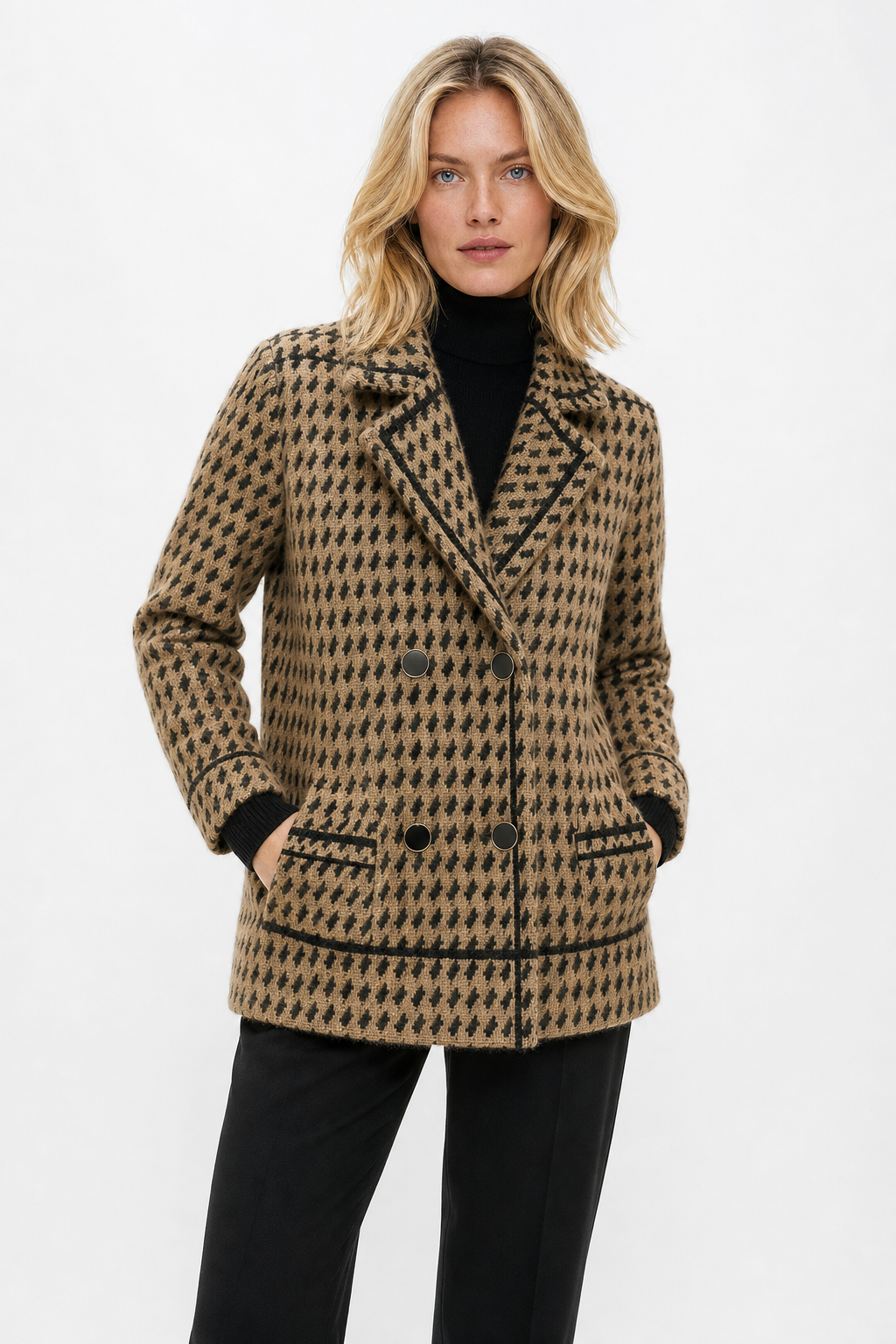 Woman wearing a cropped houndstooth knit jacket with double-breasted buttons over a black turtleneck._4