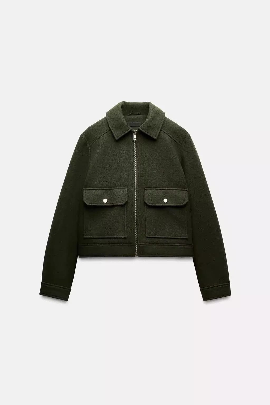 Woman wearing a cropped zip-front jacket with collar and chest pockets, styled over a light sweater and dark pants._8