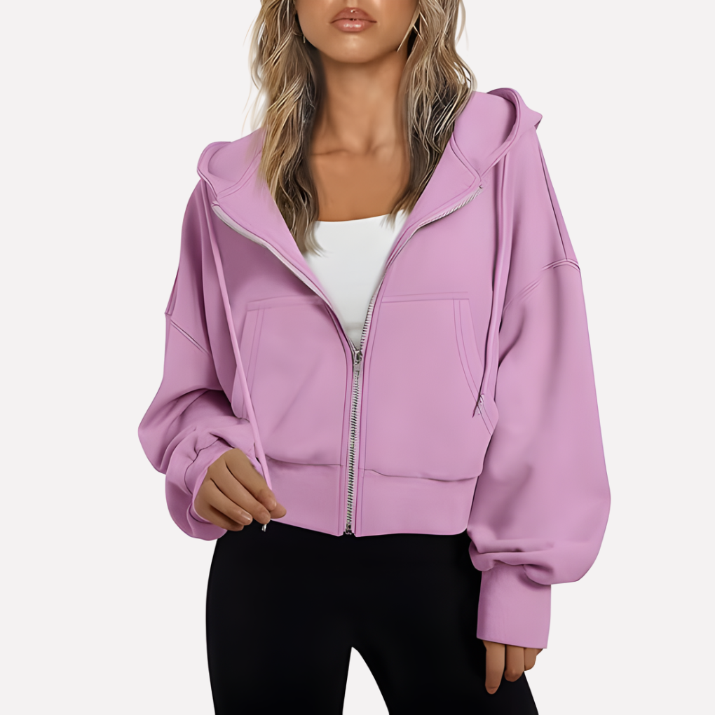 Lilac cropped zip-up hoodie with a drawstring hood, oversized sleeves, front pockets, and ribbed cuffs and hem.