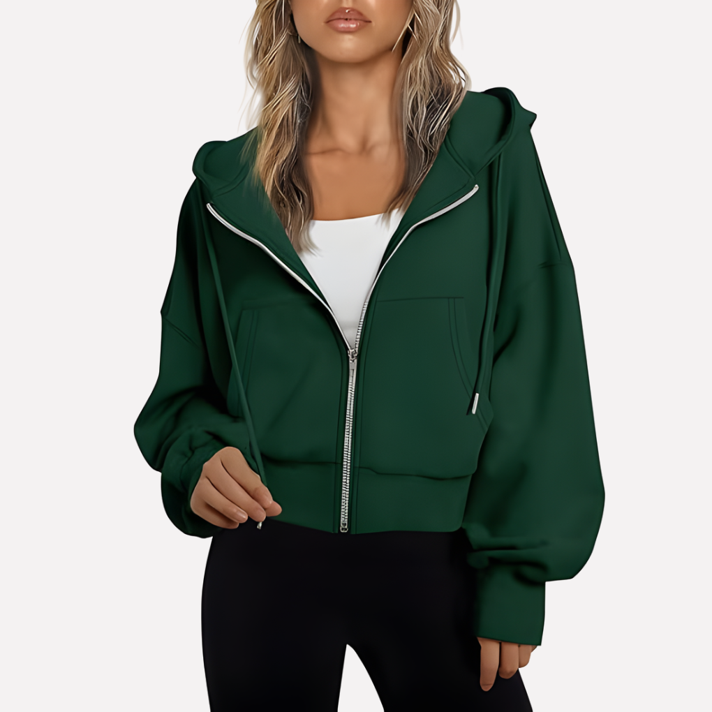 Deep green cropped zip-up hoodie with an open drawstring hood, voluminous sleeves, front pockets, and ribbed lower trim.
