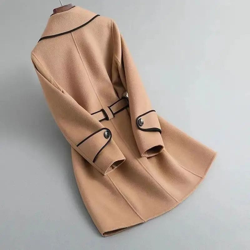 A wrap coat with contrast trim, a belted waist, and buttoned cuffs displayed against a light background._1