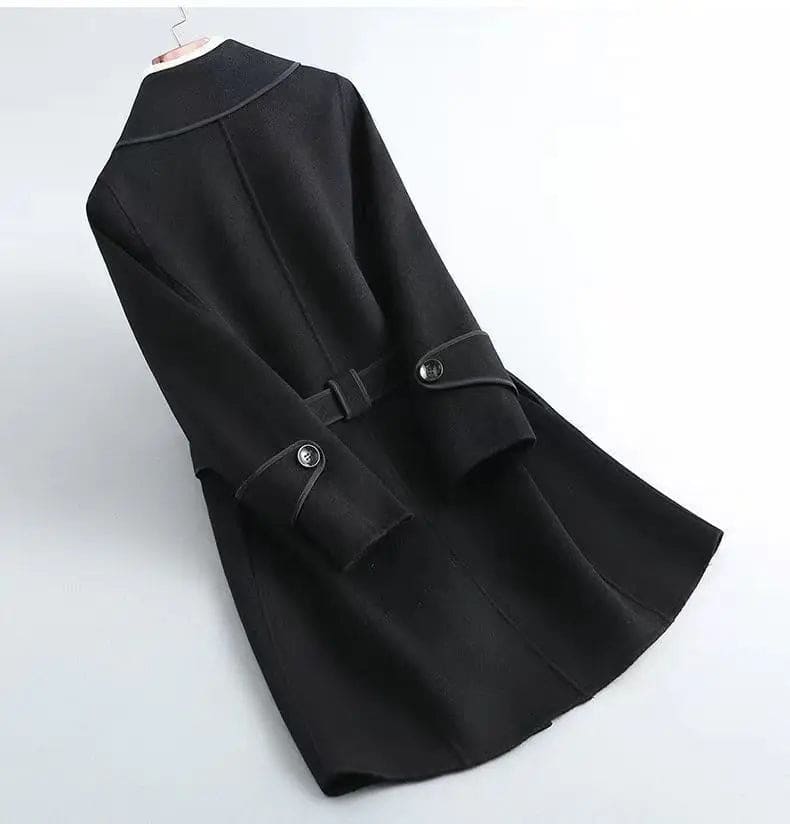A wrap coat with contrast trim, a belted waist, and buttoned cuffs displayed against a light background._5