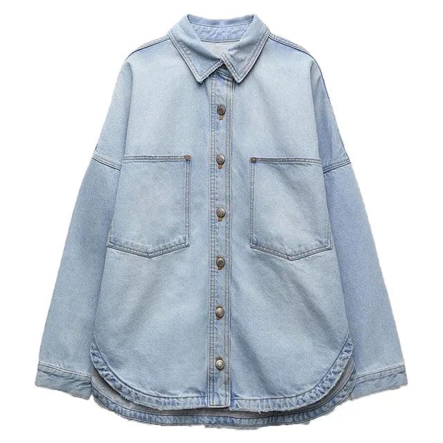 Woman wearing an oversized denim shirt jacket with button front, styled with matching jeans and neutral background._11