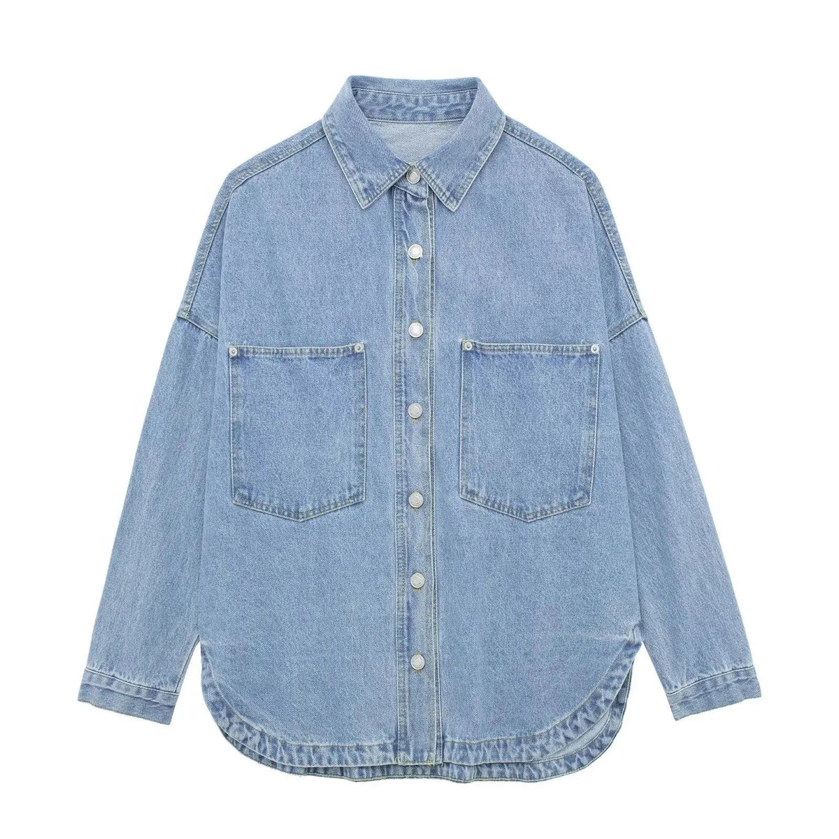 Woman wearing an oversized denim shirt jacket with button front, styled with matching jeans and neutral background._12