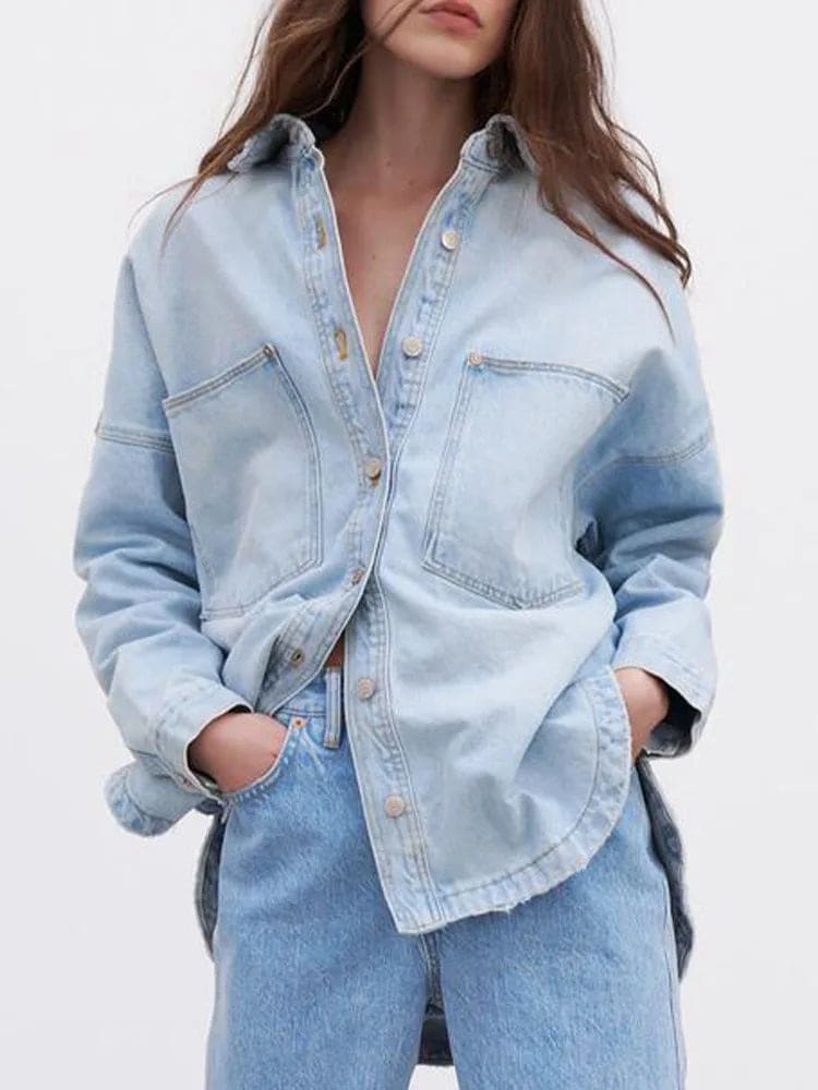 Woman wearing an oversized denim shirt jacket with button front, styled with matching jeans and neutral background._4
