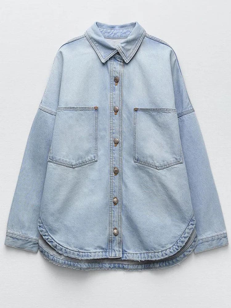 Woman wearing an oversized denim shirt jacket with button front, styled with matching jeans and neutral background._9