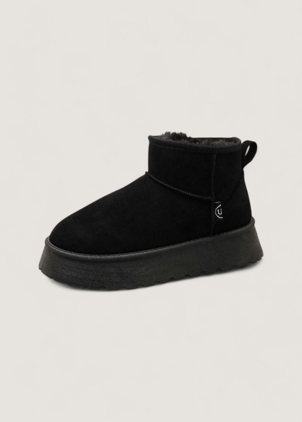 Black faux fur lined platform ankle boot shown in side profile with a rounded toe and back pull tab.