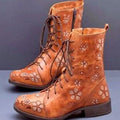 Tan floral embroidered ankle boots with lace-up fronts, rounded toes, side zippers, and low block heels.