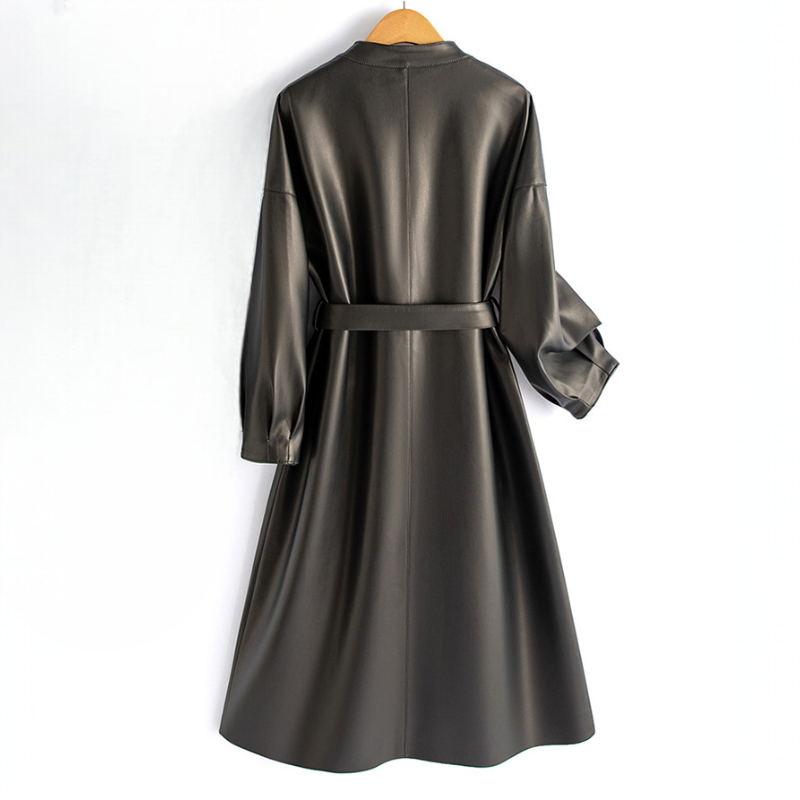 A long-sleeve wrap coat with a V neckline, self-tie waist belt, and softly flared skirt hangs on a wooden hanger._1