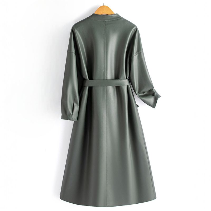 A long-sleeve wrap coat with a V neckline, self-tie waist belt, and softly flared skirt hangs on a wooden hanger._7