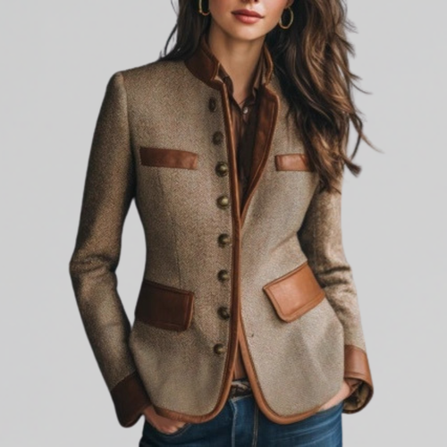 Woman wearing a tailored blazer with stand collar, button front, and contrast trim detailing at the pockets and edges._0