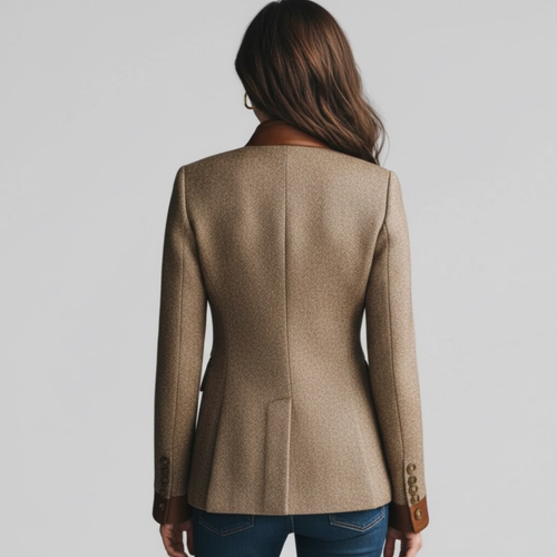 Woman wearing a tailored blazer with stand collar, button front, and contrast trim detailing at the pockets and edges._1