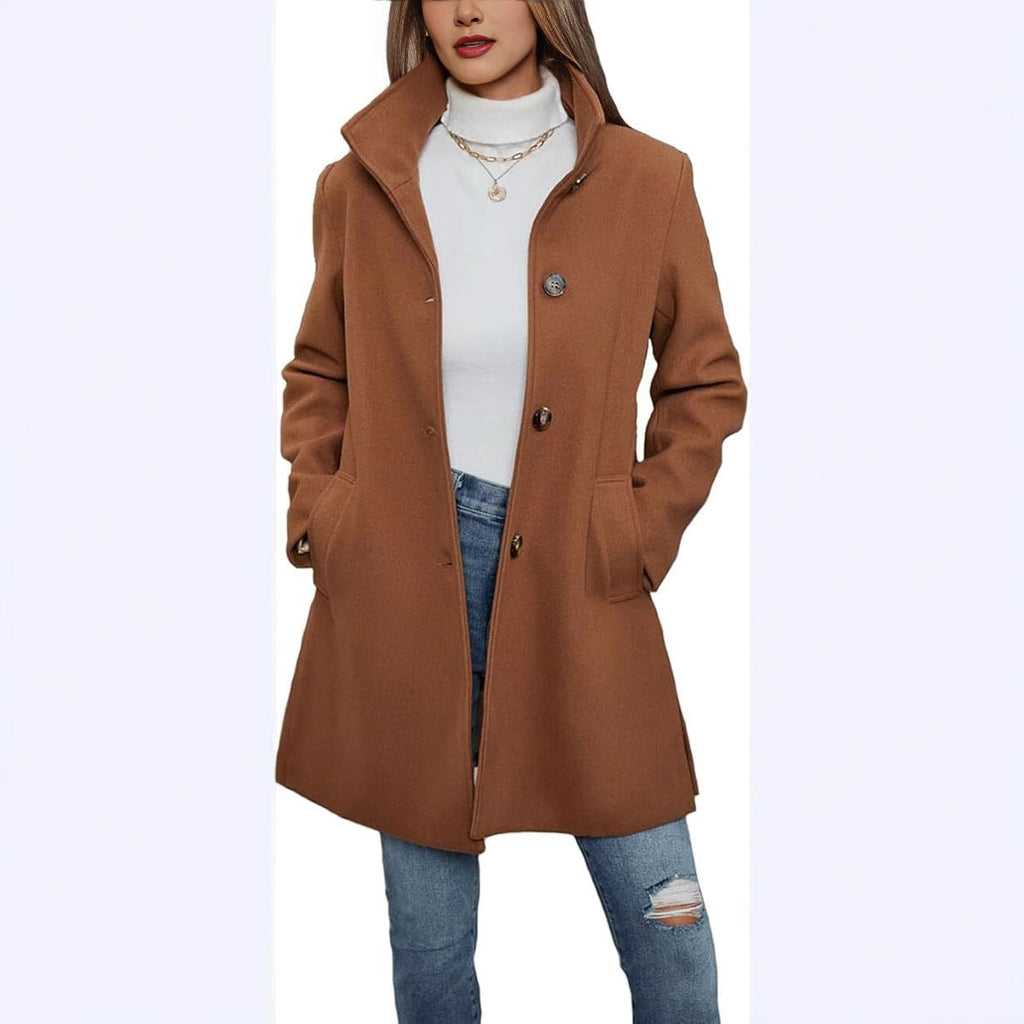 Brown high-collar button-front coat with side pockets, shown styled over a white top and jeans.