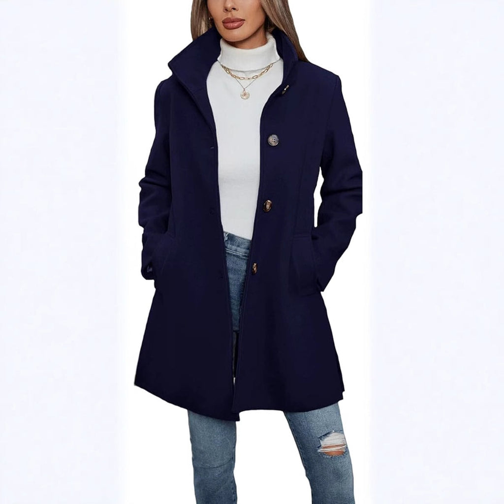 Deep navy coat with a structured high collar, visible front buttons, and a longer everyday cut.