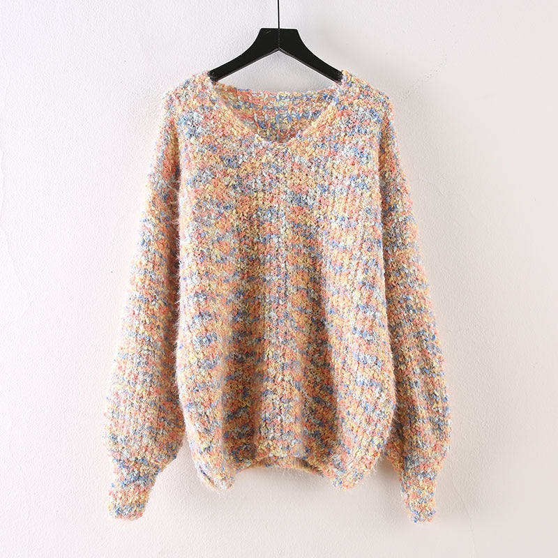 Oversized v-neck sweater on a black hanger, knitted in a speckled multicolor yarn of pink, blue, yellow and cream on a cream base, with long blouson sleeves and ribbed cuffs and hem._0