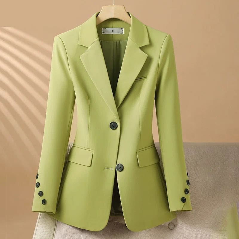 A tailored blazer with notched lapels, a two button front, flap pockets, and decorative cuff buttons displayed on a hanger._0
