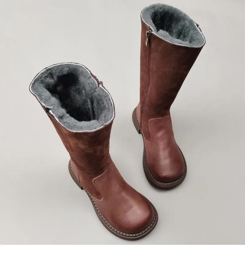 Pair of knee high riding boots with side zipper and plush lining shown from above._0