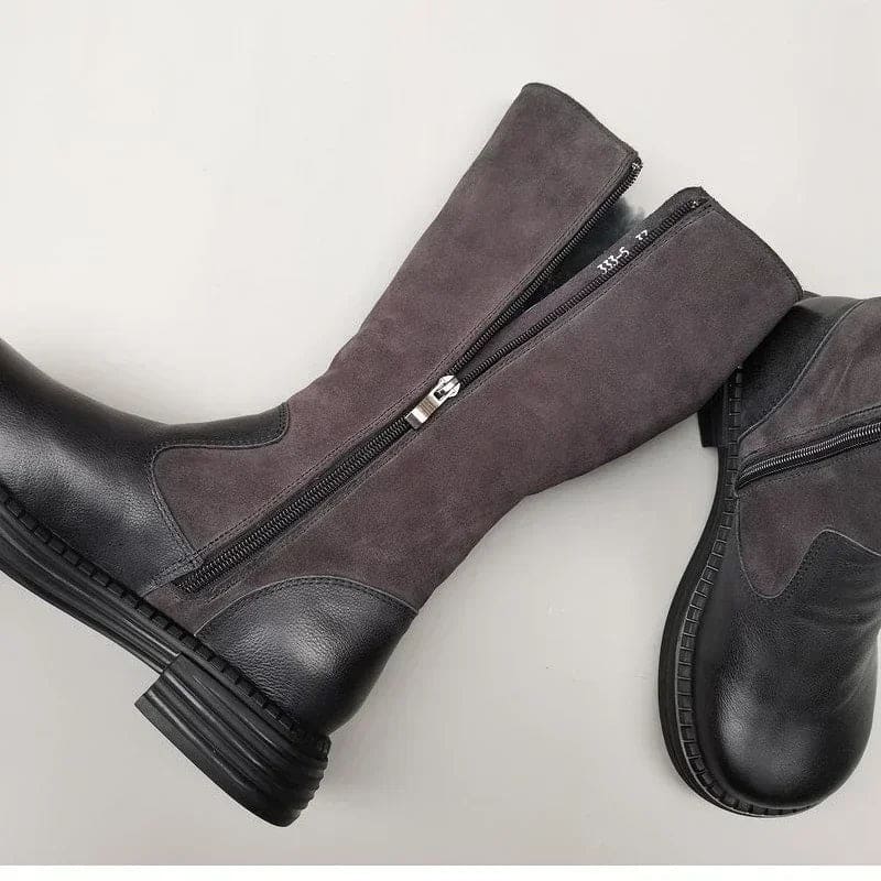 Pair of knee high riding boots with side zipper and plush lining shown from above._1