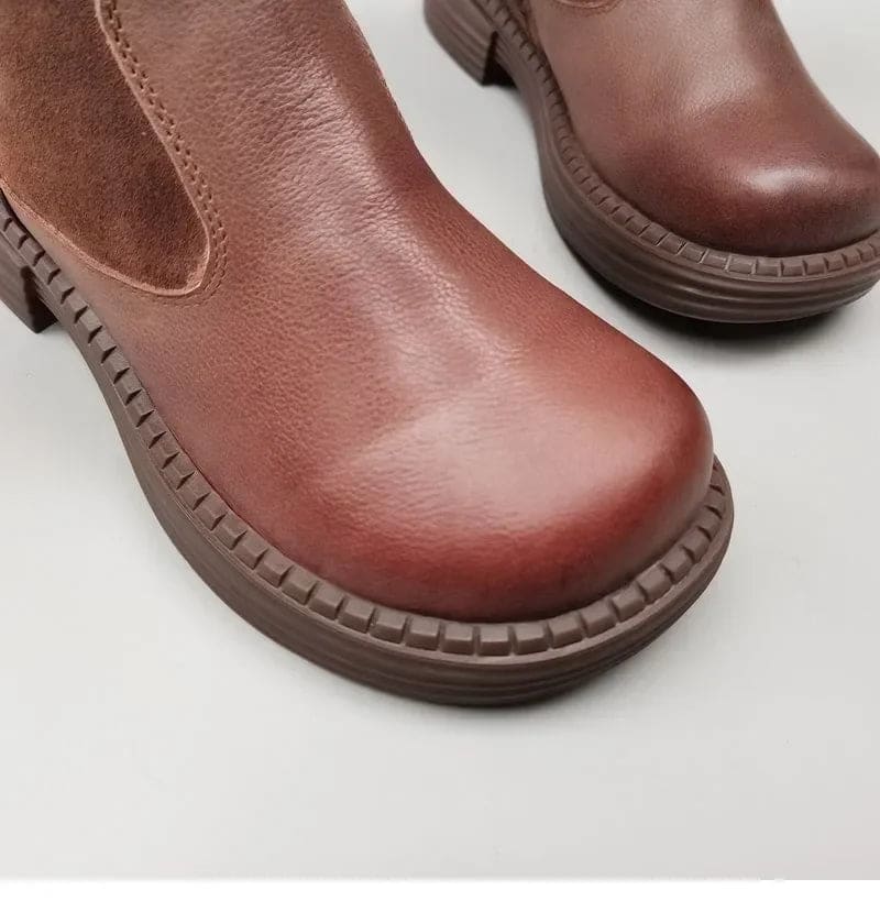 Pair of knee high riding boots with side zipper and plush lining shown from above._10