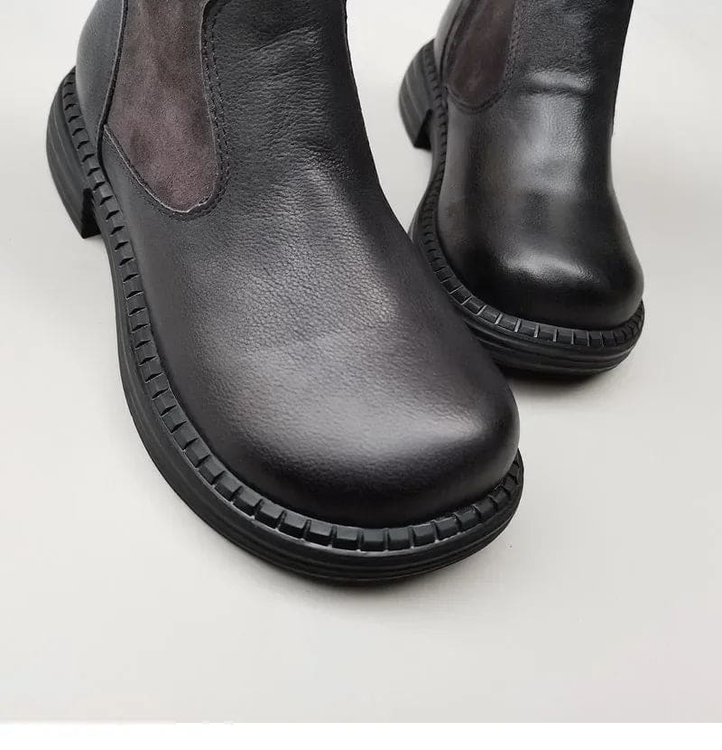 Pair of knee high riding boots with side zipper and plush lining shown from above._11