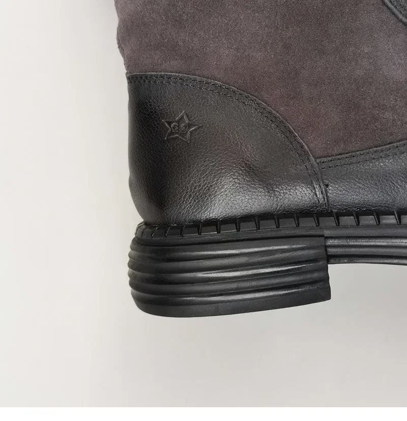 Pair of knee high riding boots with side zipper and plush lining shown from above._12