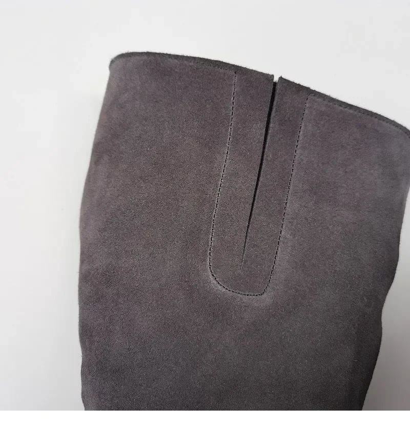 Pair of knee high riding boots with side zipper and plush lining shown from above._13