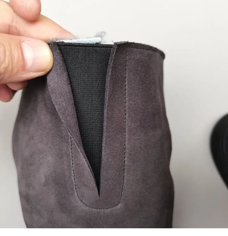Pair of knee high riding boots with side zipper and plush lining shown from above._14