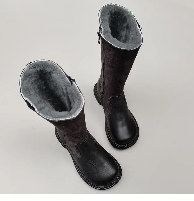 Pair of knee high riding boots with side zipper and plush lining shown from above._2