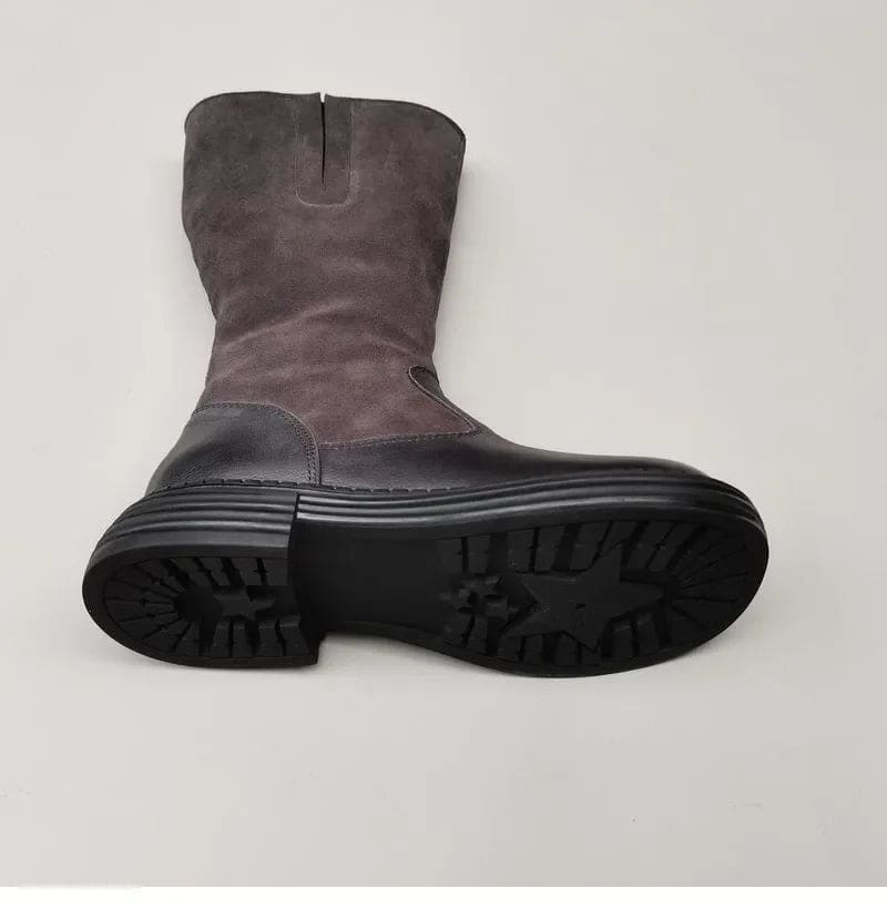 Pair of knee high riding boots with side zipper and plush lining shown from above._21